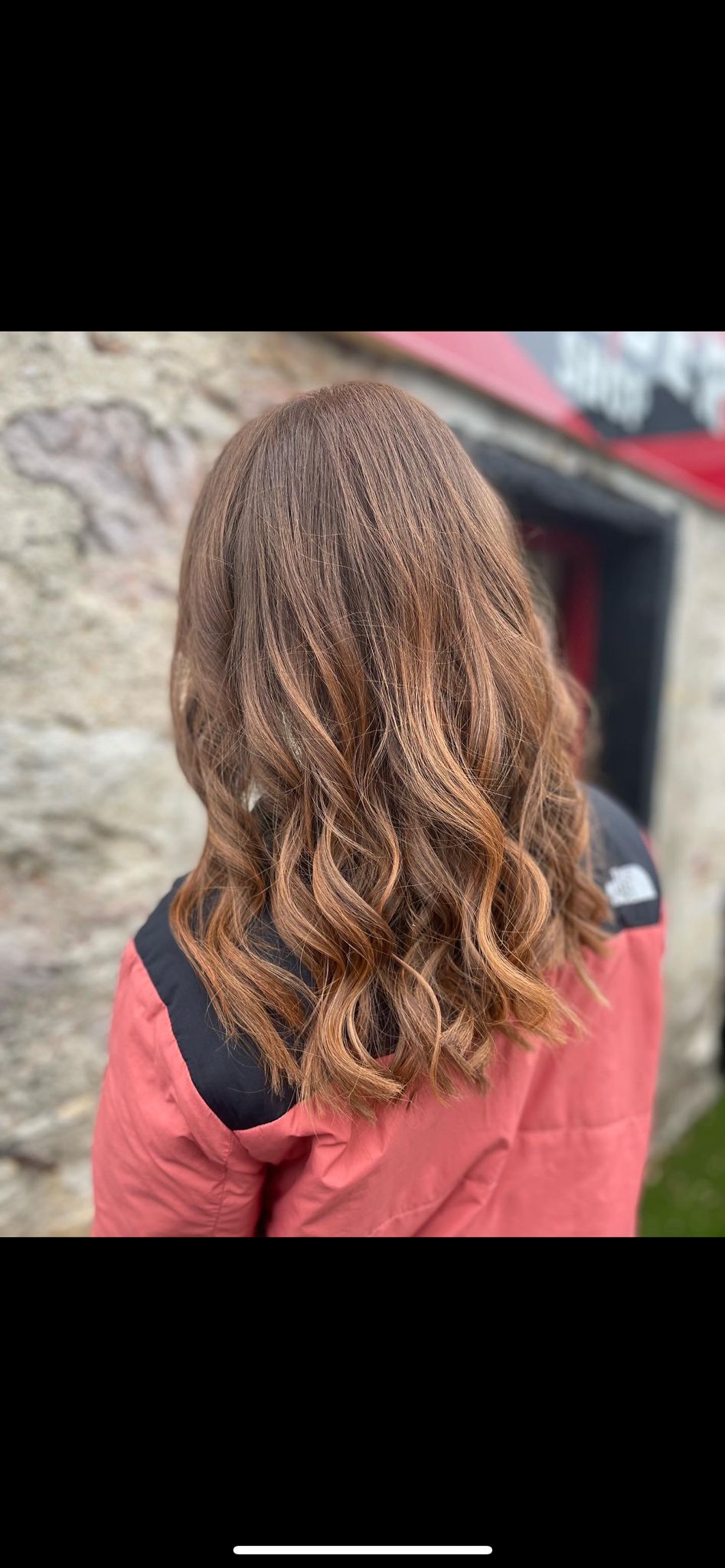 Client with soft, natural brown highlights and waves